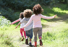 three children playing outside