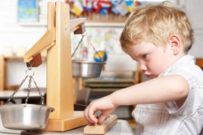 child playing with wooden toy