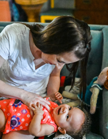 a woman holding baby