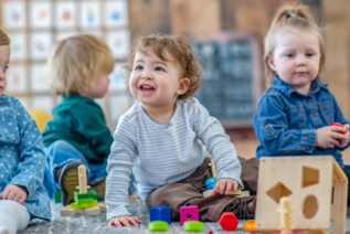 A group of children playing with toys